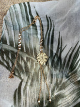 Load image into Gallery viewer, Gold Monstera leaf necklace and earrings.
